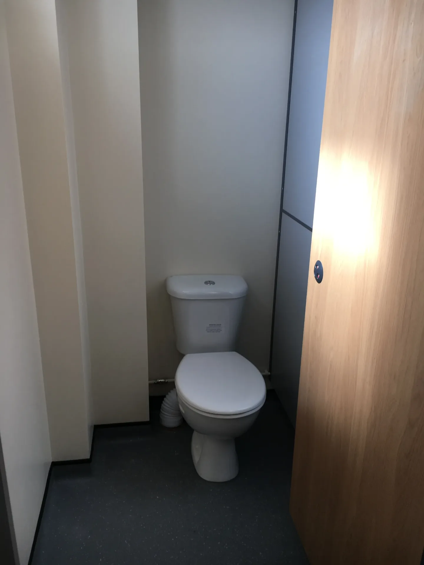 Private WC cubicle with oak door